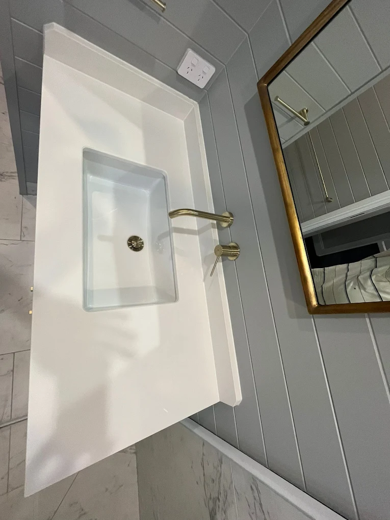 Bathroom vanity and gold tapware