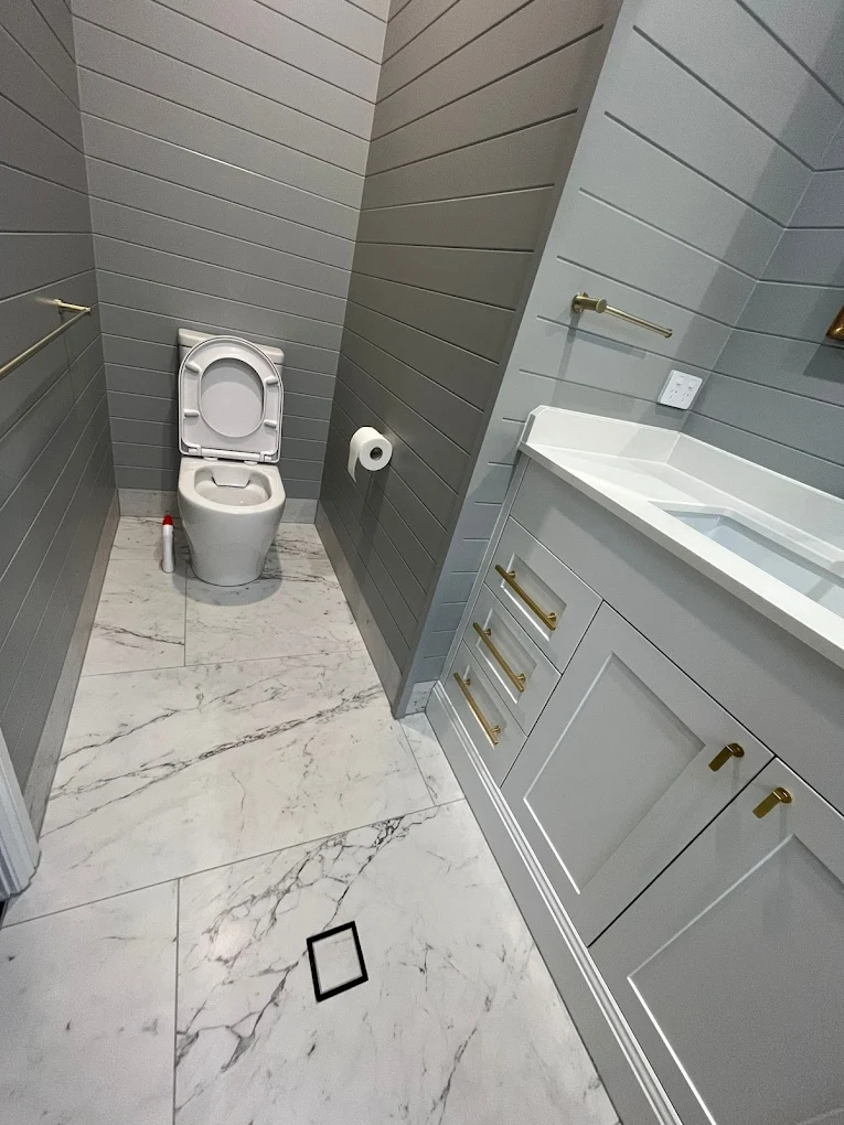 Powder room with brass tapware